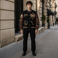 Phantom Masquerade Halloween varsity jacket worn outdoors with black body, burgundy sleeves and gothic embroidered patches