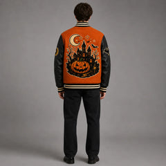 Back studio view of orange and black Halloween varsity jacket showing large haunted castle, pumpkin, moon and bat embroidery
