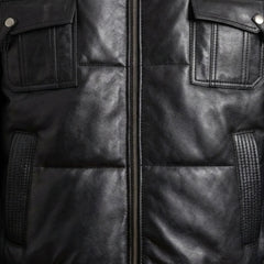 Detail of zipper and chest flap pockets on men's black puffer bomber leather jacket
