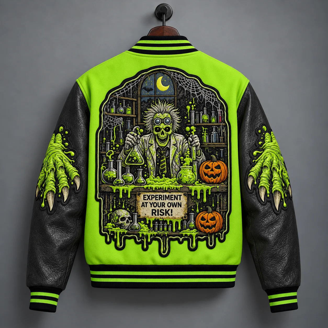 Back hanger view of Mad Scientist Halloween varsity jacket with laboratory scene, pumpkins, moon and spider webs