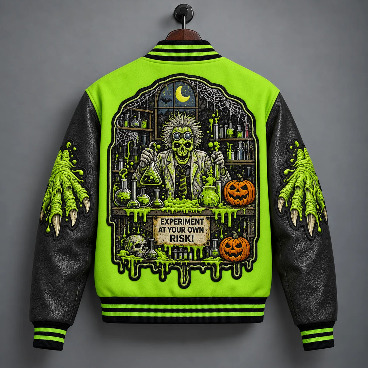 Back hanger view of Mad Scientist Halloween varsity jacket with laboratory scene, pumpkins, moon and spider webs