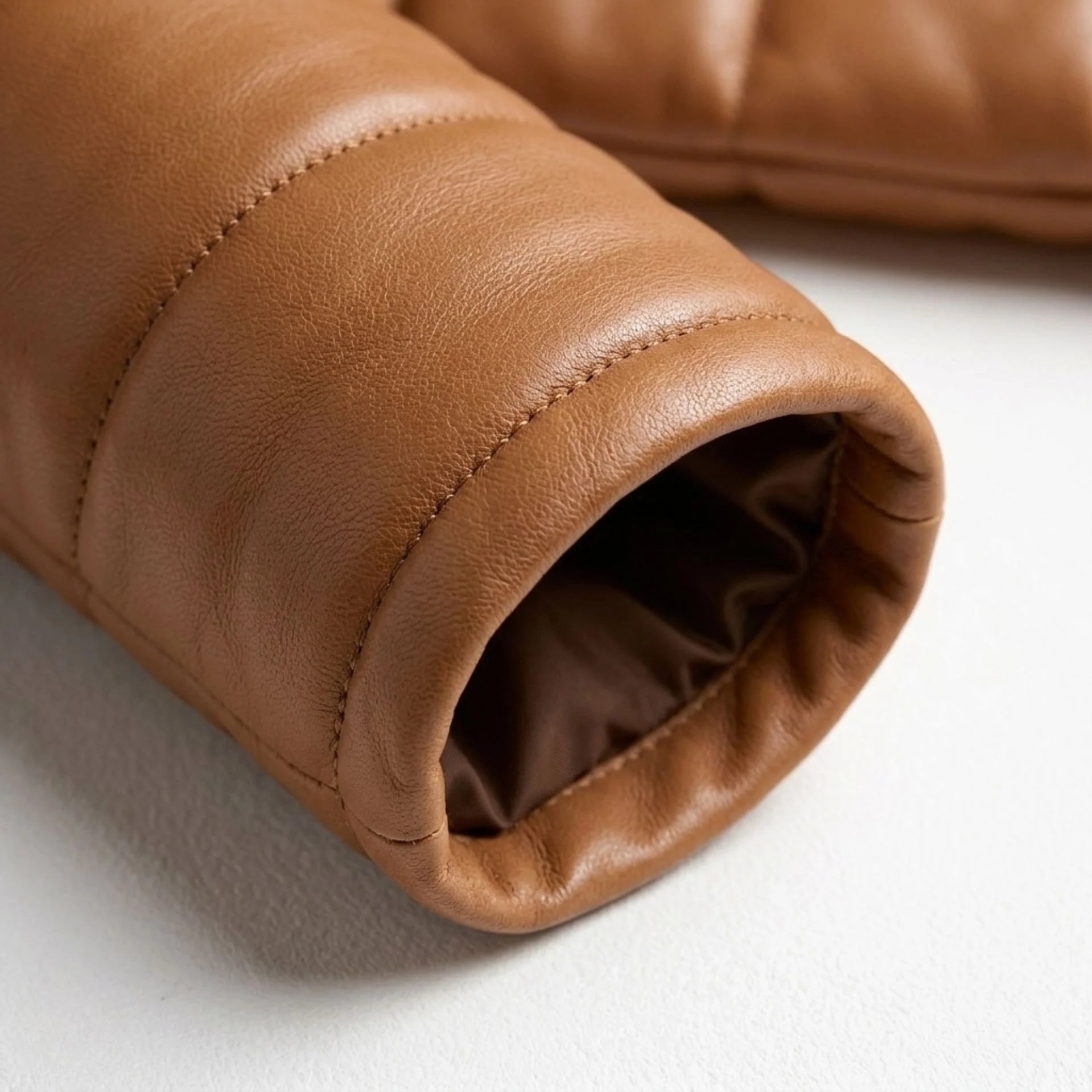 Detailed view of sleeve cuff and premium sheepskin leather texture