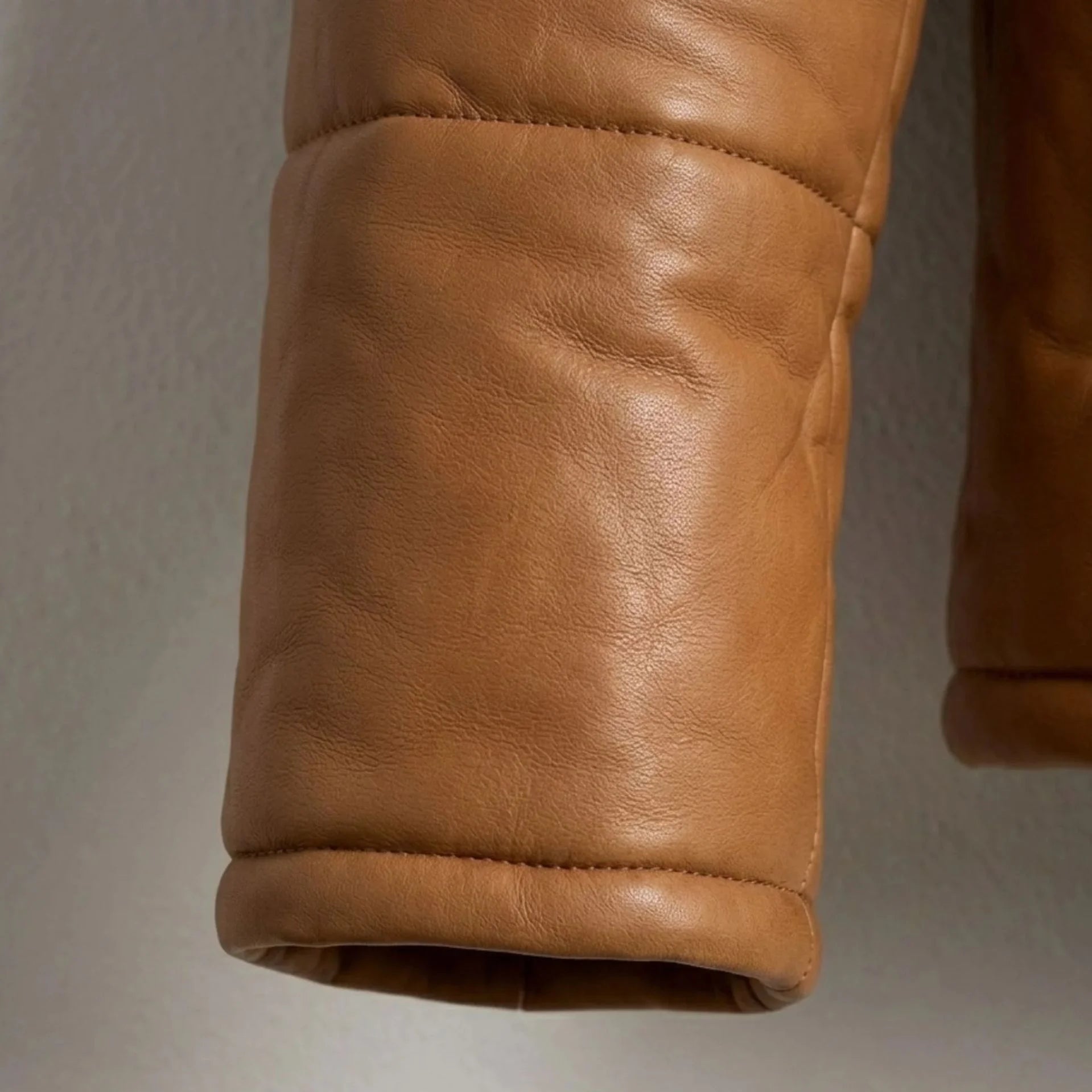 Detailed view of hidden rib cuff and premium sheepskin leather texture