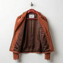 Interior lining of tan suede biker jacket showing brown lining and inner pocket