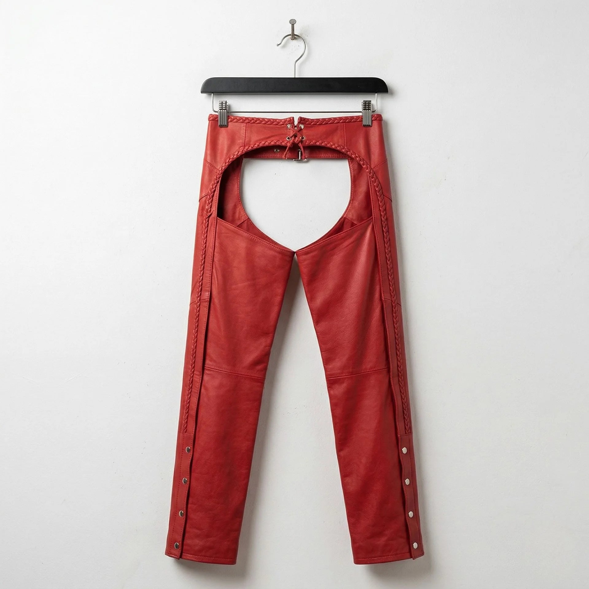 Back view of red leather chaps showing open seat and rear lacing