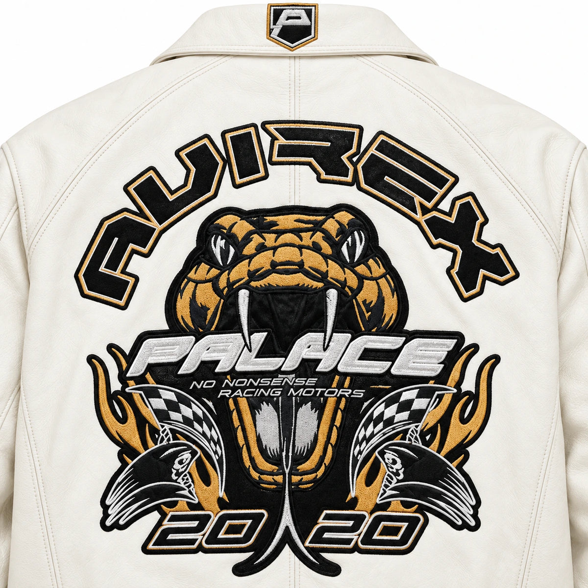 Close-up of white bomber jacket back artwork with bold black, gold and silver snake and racing-inspired graphics
