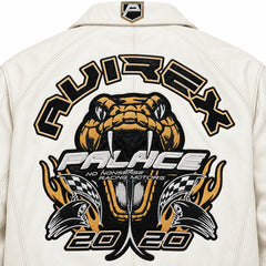 Close-up of white bomber jacket back artwork with bold black, gold and silver snake and racing-inspired graphics