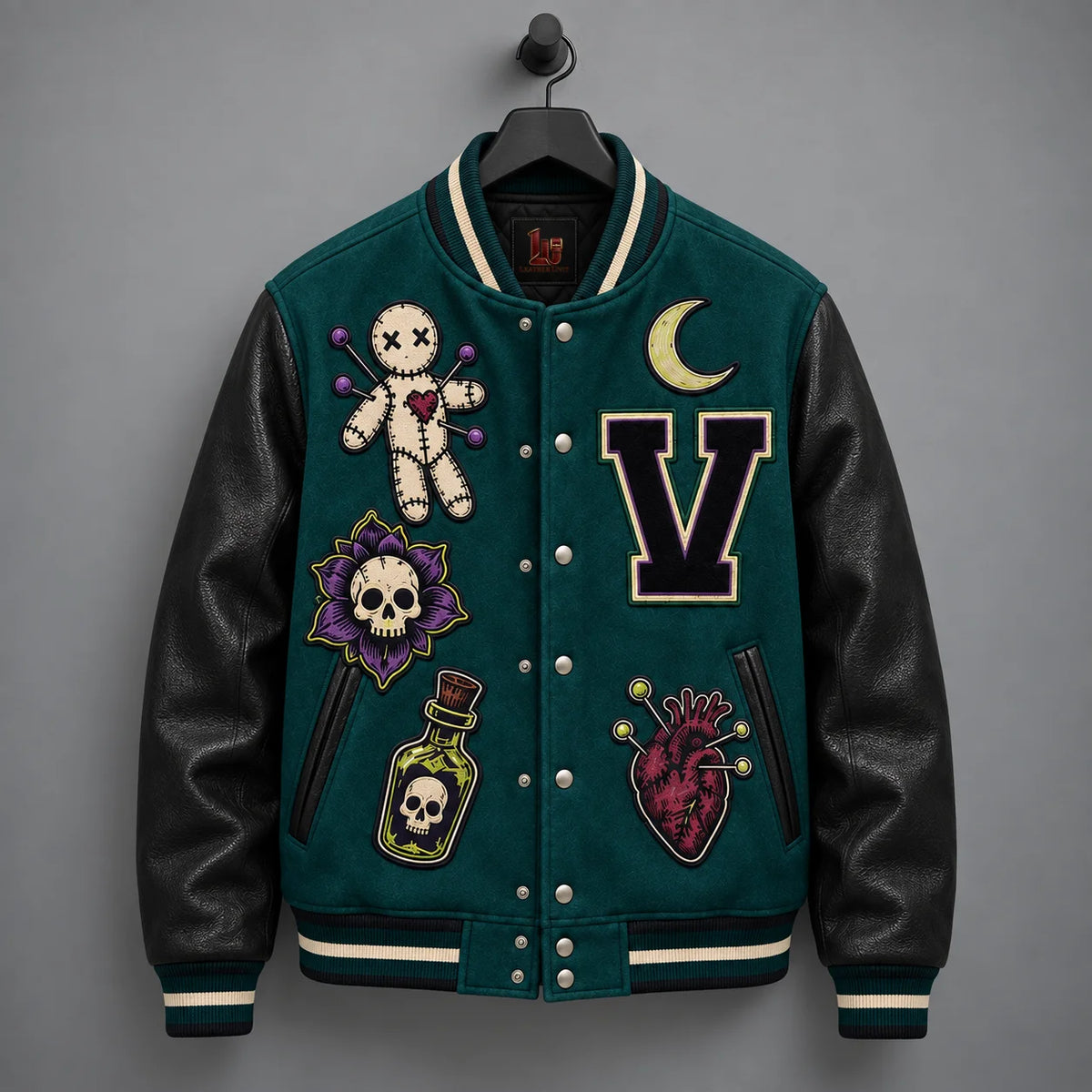Front hanging view of Voodoo Bloom Halloween jacket with embroidered patches, snap front and leather sleeves
