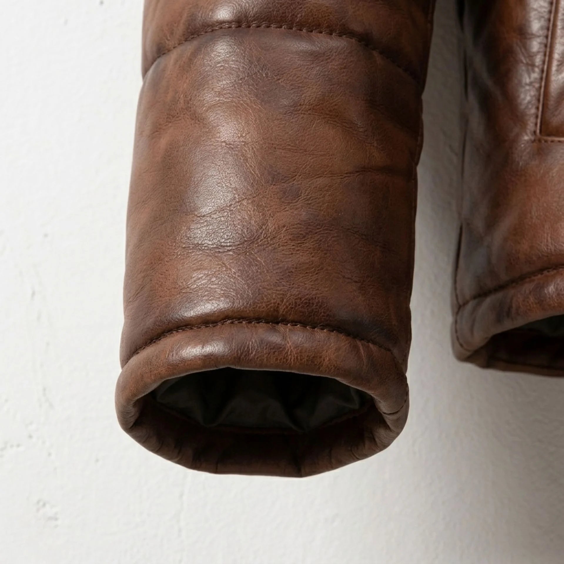Detailed view of hidden rib cuff and premium waxed sheepskin texture