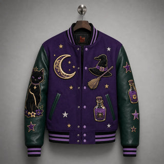 Hanging front view of purple varsity jacket with dark emerald cowhide sleeves, striped ribbing and Halloween embroidery