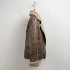 Side profile of women’s brown shearling aviator leather bomber jacket