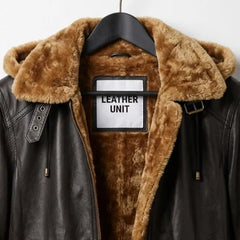 Close-up of fur-lined hood and collar on women’s brown aviator leather jacket