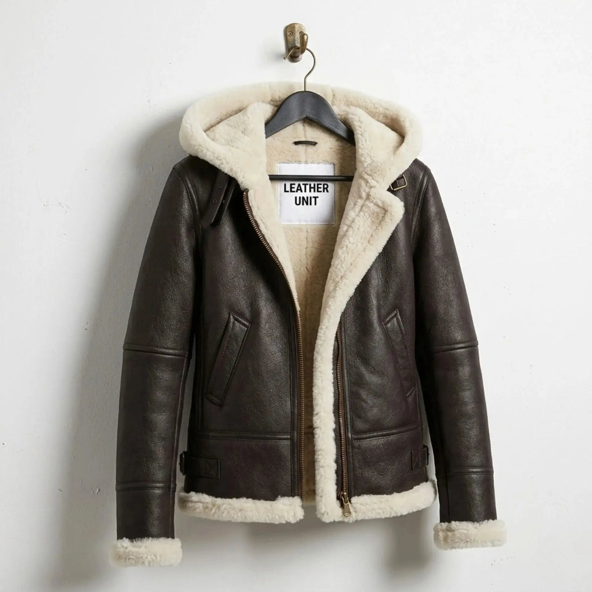 Front view of Leather Unit women’s brown B3 shearling aviator hooded leather jacket on hanger