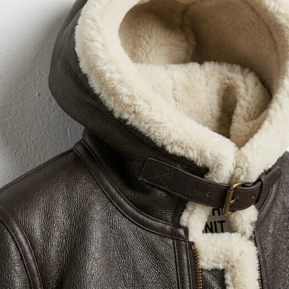 Close up of hood and collar buckle on women’s brown B3 shearling aviator jacket