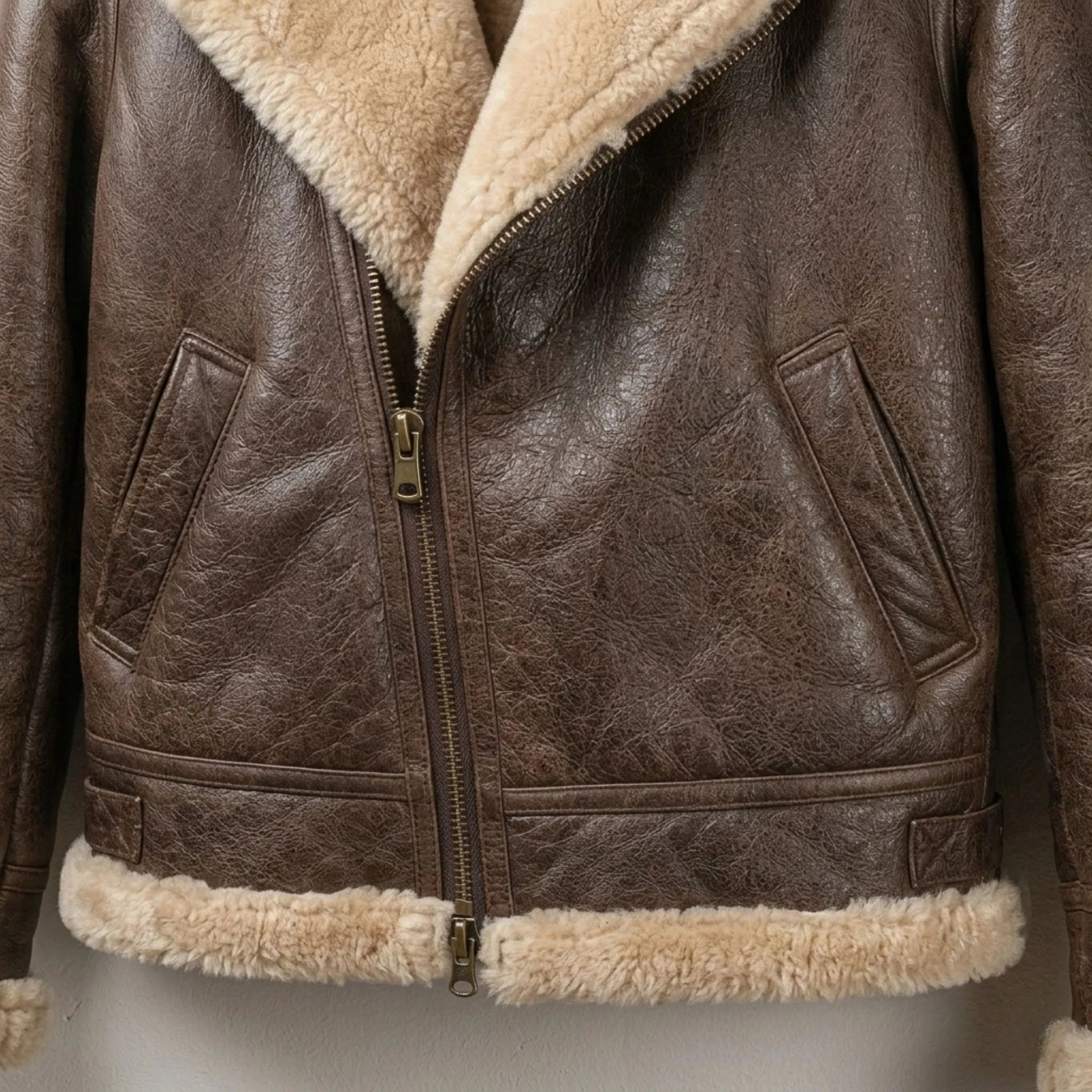 Zipped front and hem detail on women’s brown shearling leather bomber jacket