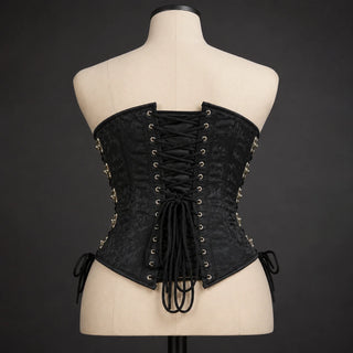 Back product view of black gothic underbust corset showing cross lacing, eyelets and structured waist silhouette.