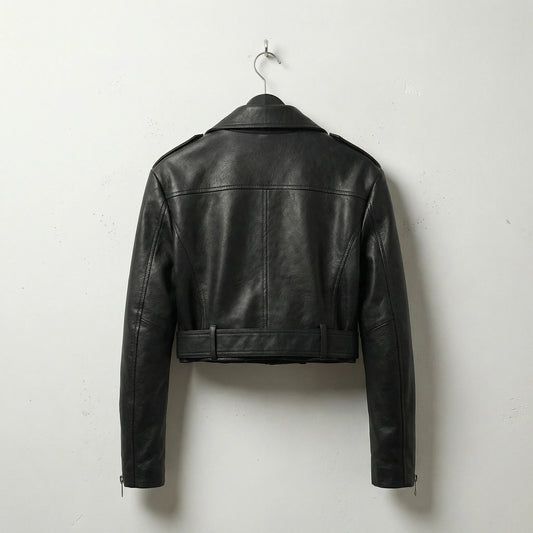 Back view of women’s black cropped leather motorcycle jacket