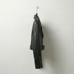 Side profile of women’s black cropped leather biker jacket with belted waist