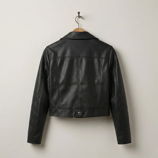 Back view of women’s black cropped leather biker jacket