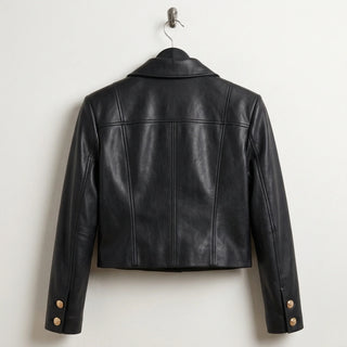 Back view of women’s cropped black leather military jacket