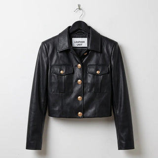 Front view of women’s black leather military jacket with gold buttons by Leather Unit