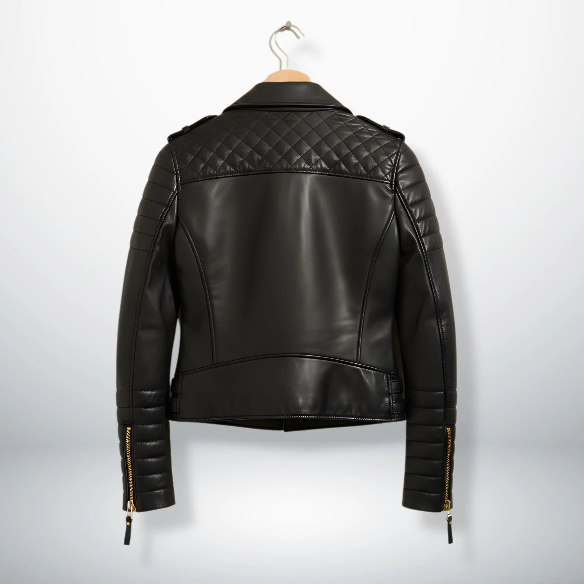 back view womens black quilted leather biker jacket on hanger.