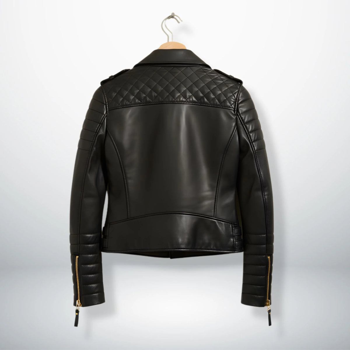 back view womens black quilted leather biker jacket on hanger.