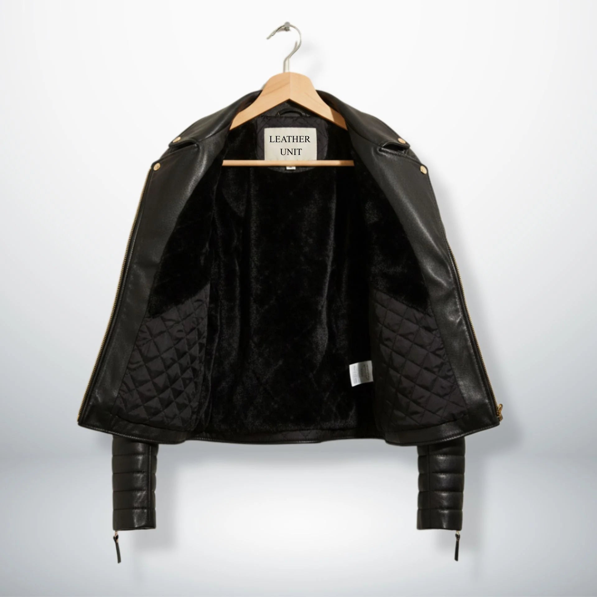 inside view womens black leather jacket with faux fur and quilted lining.