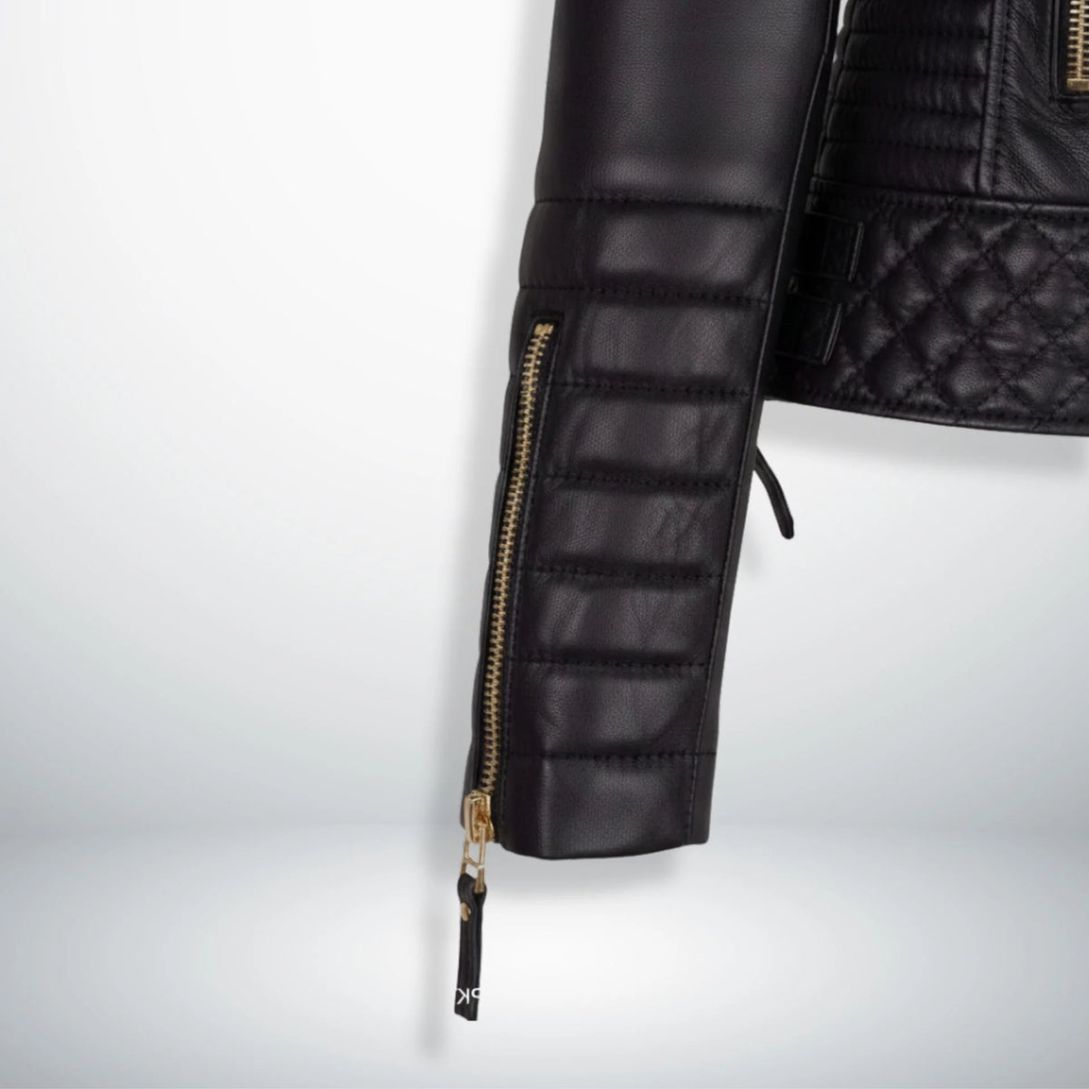 close up padded sleeve and zipper cuff on womens black motorcycle jacket.
