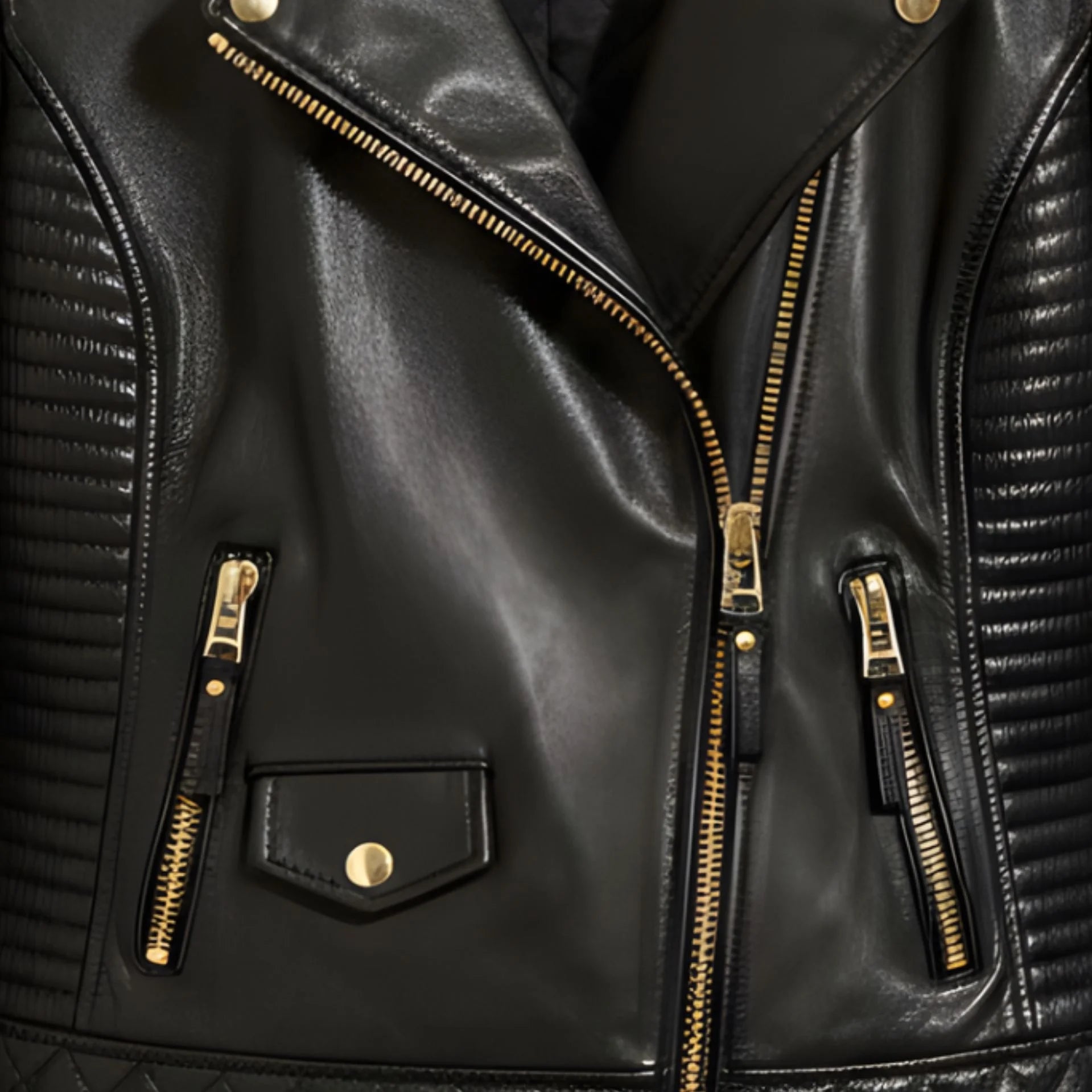 close up gold zipper pockets and flap pocket on womens black leather jacket.