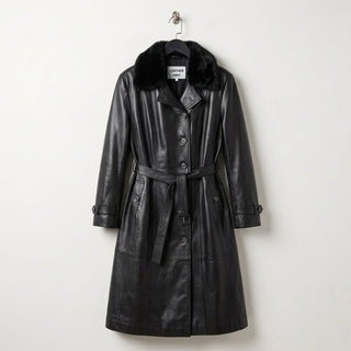 Front view of women’s black leather trench coat with faux fur collar and belt by Leather Unit