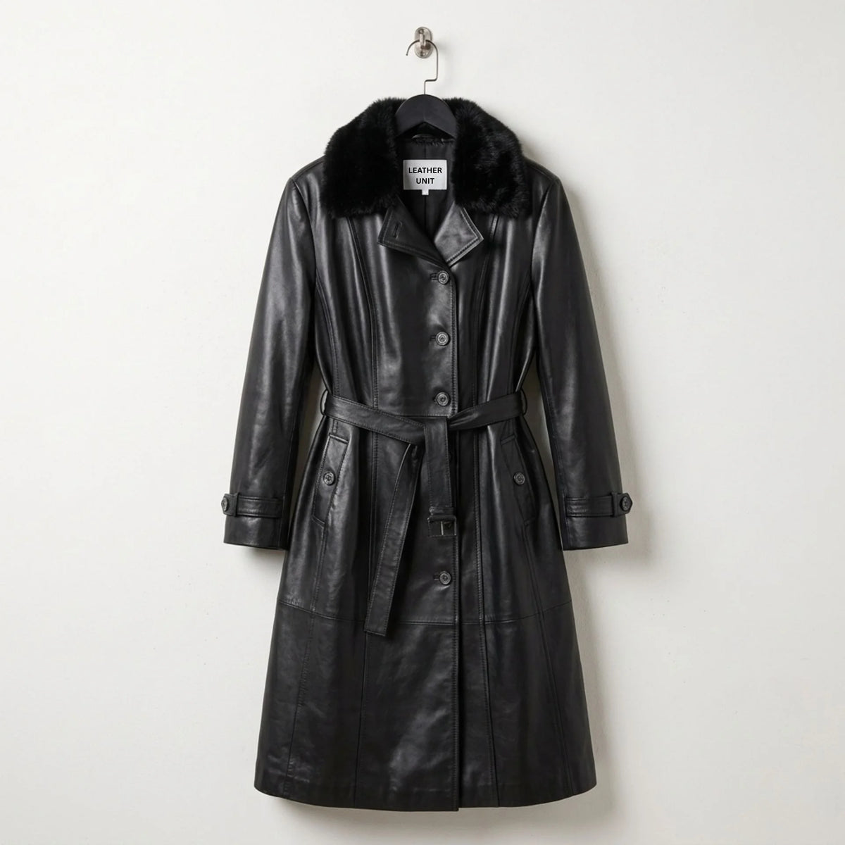 Front view of women’s black leather trench coat with faux fur collar and belt by Leather Unit