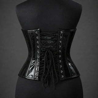 Back mannequin view of shiny black PVC underbust corset with black cord lacing, eyelets and curved waist silhouette.