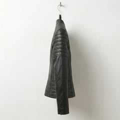 Side profile of women’s slim fit black leather biker jacket with quilting