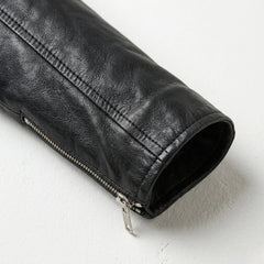 Sleeve and zipper cuff detail on women’s black leather biker jacket