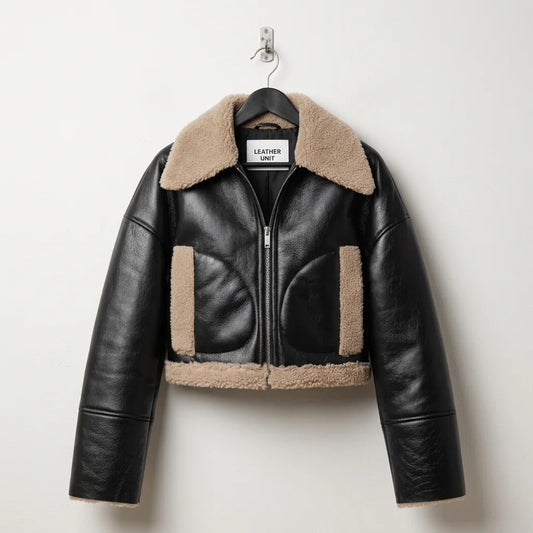 Front view of women’s black shearling cropped leather aviator jacket by Leather Unit