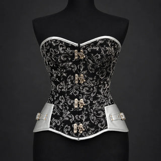 Front studio view of black silver overbust corset showing floral pattern, silver trim and four decorative clasps