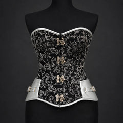Front studio view of black silver overbust corset showing floral pattern, silver trim and four decorative clasps