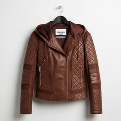 Front view of women’s brown hooded moto leather jacket featuring quilted shoulders and gold zipper pockets.