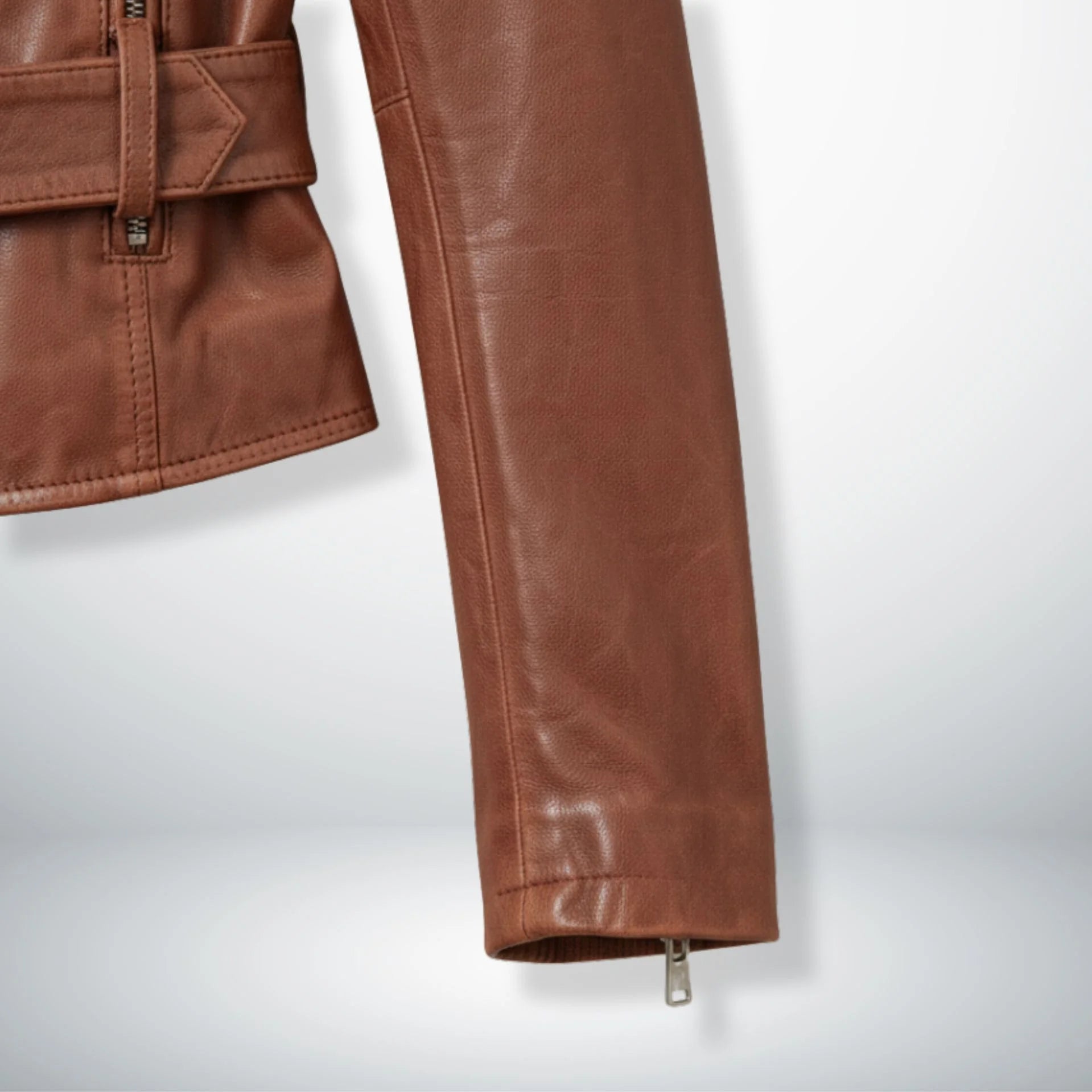 sleeve and cuff zipper detail on women's brown leather biker jacket.