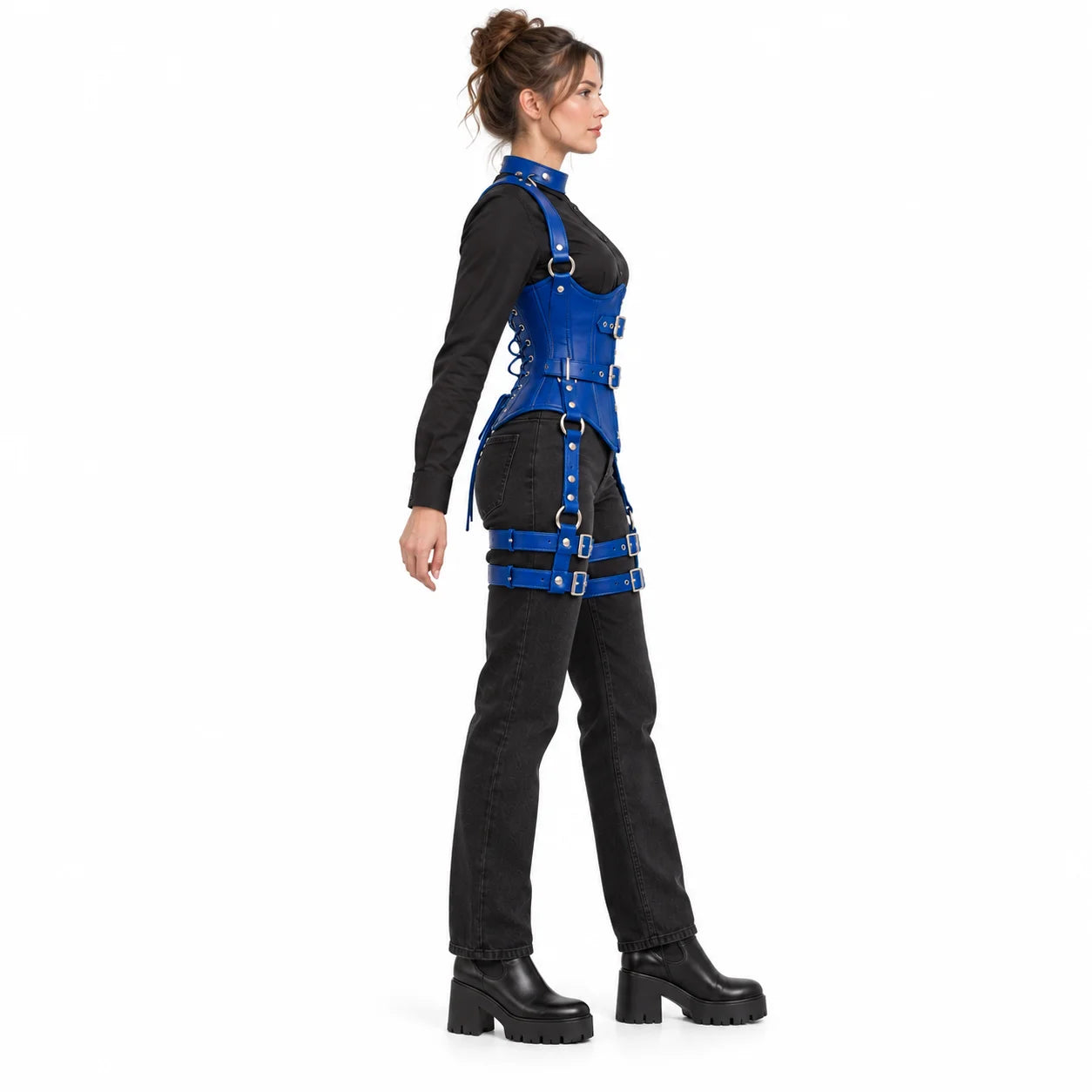 Woman modelling a cobalt blue leather underbust corset from the side with buckle straps and silver-tone hardware.