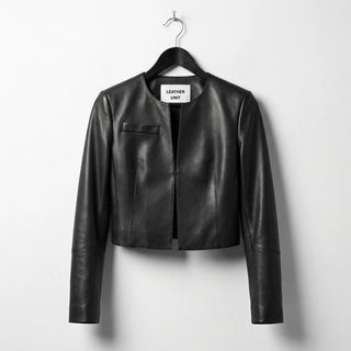 Front view of women's cropped black leather jacket with round neck by Leather Unit