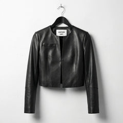 Front view of women's cropped black leather jacket with round neck by Leather Unit