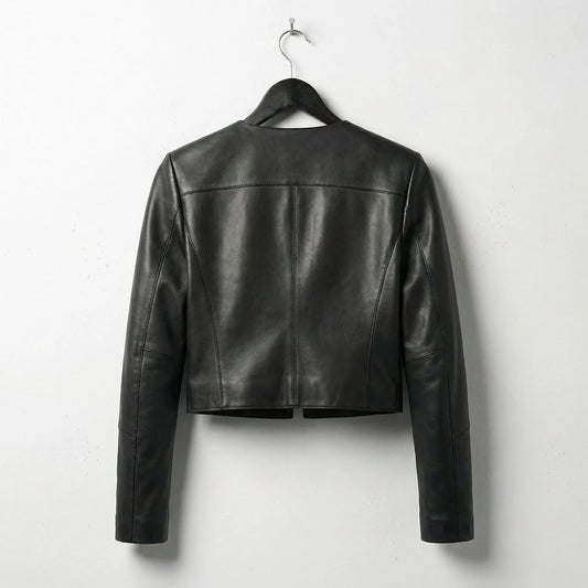 Back view of women's cropped black leather leather jacket showing clean seams