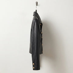 Side profile of cropped women’s black military leather jacket