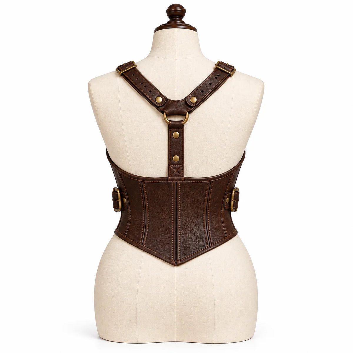 Rear view of brown leather corset with Y-shaped shoulder harness, centre D-ring connection and pointed waist hem.