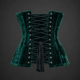 Back product view of green velvet corset showing adjustable black lacing, silver-tone eyelets and modesty panel.