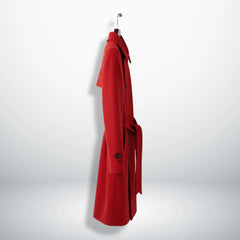 Side profile of belted women’s red single breasted wool coat