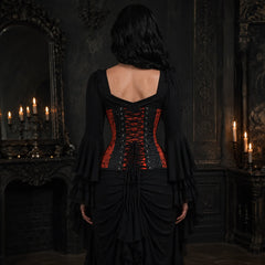 Rear model view of red and black gothic corset showing adjustable black cross lacing, eyelets and shaped brocade panels