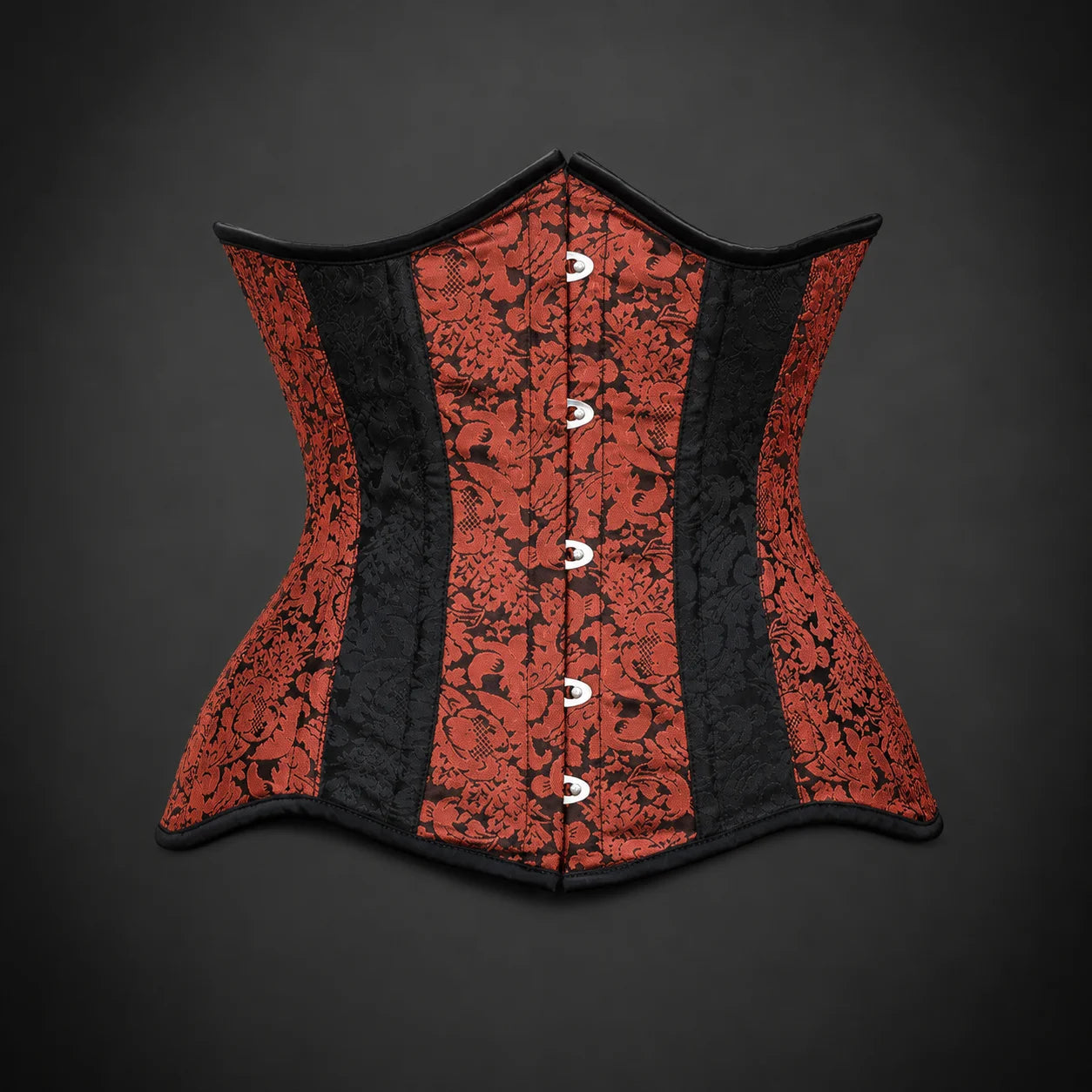 Front product view of red and black brocade steel boned underbust corset with black binding and silver-tone fastening